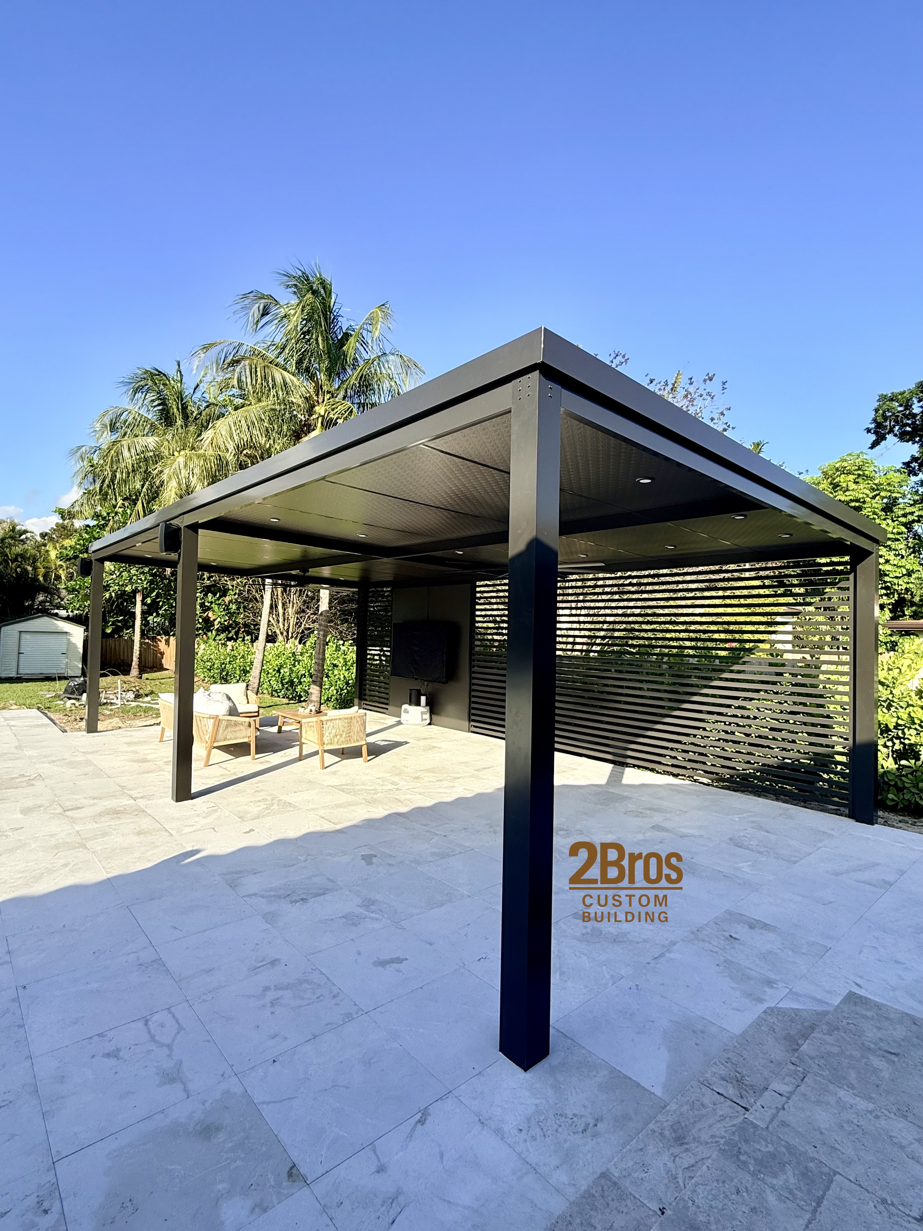 Dark pergola corner detail showing precision aluminum construction